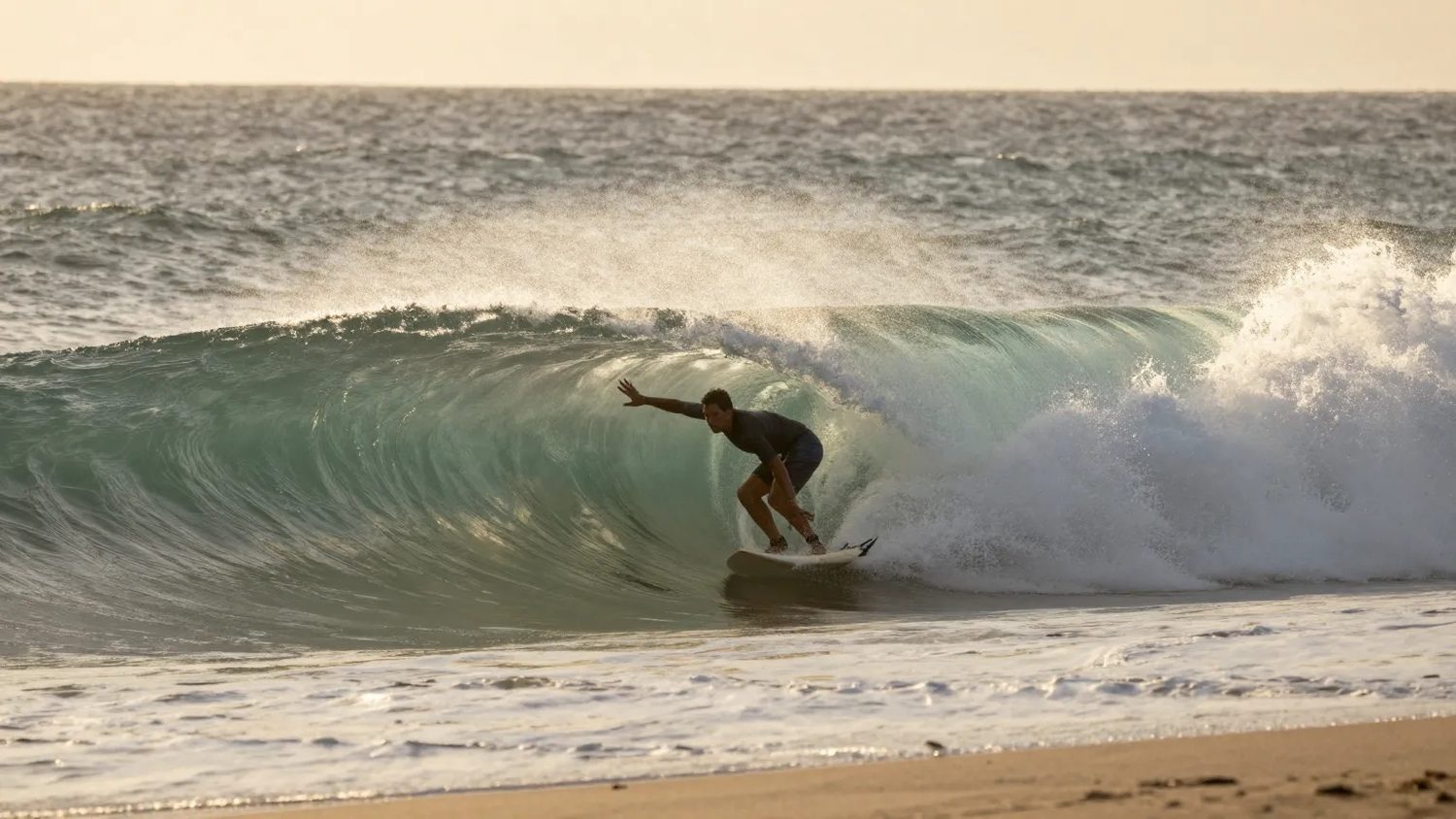 A surfer inside the barrel of a wave on the reef break